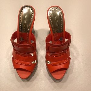 Lovely orange BCBGirls wedges barely worn. Size 8